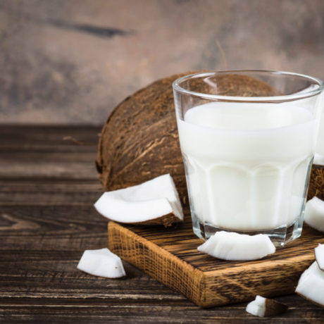 Coconut milk in glass, Vegan milk.